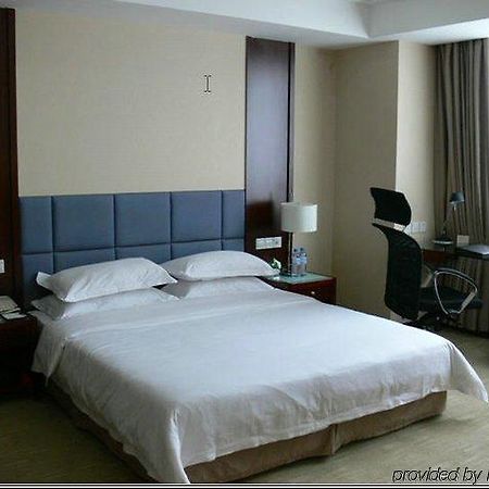 New Land Business Hotel Wuhan Quarto foto